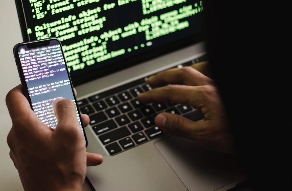 Code on phone and laptop - online security